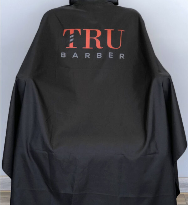 TRUBARBER PROFESSIONAL BARBER CAPE - Black With Red Letters