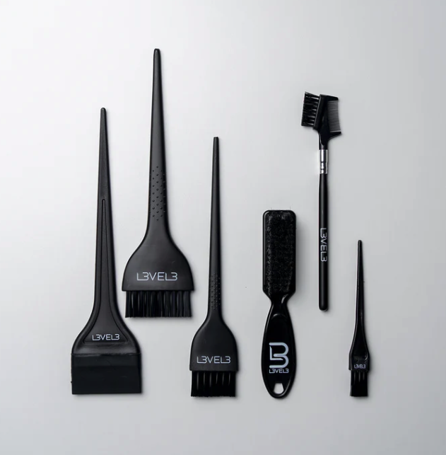 L3VEL3™ Tint Brush Set - 6 Pc Tint brush pack that comes with every size suitable for any situation! Achieving dope results with hair dye takes skill, but also the right tools. Mixing powdered or liquid dyes is a messy business and requires care to achieve the perfect texture. When it comes to application, only precise work will ensure even distribution and coverage. We know the score, so we’ve created this set that includes a hair color brush for every need. Effective yet gentle bristles and easy-grip handles get the job done, no muss, no fuss. Whether you’re tinting, creating hair art, coloring a full head, or dyeing a beard, our tint brush set should be your go-to. Key Features Includes six different brushes for tinting and coloring hair and facial hair Bristles are firm enough for neat application but gentle on scalp and skin Sturdy handles are comfortable to hold and feature an easy-grip finish Fine handle tips allow for quick and easy yet precise hair parting Pro design and solid performance, made for mixing and applying hair dye