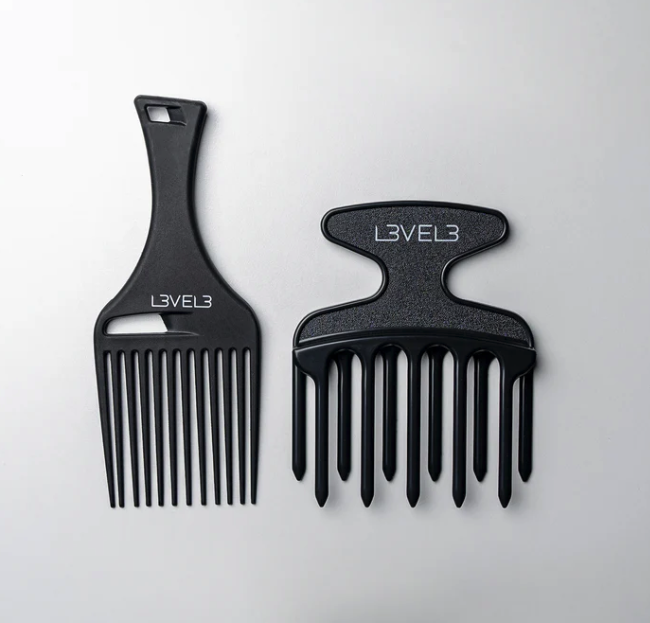 L3VEL3 Hair Pick Comb Set – 2 Pc Our hair picks gently separate, volumize, and style all types of natural curls. Curls need special care to keep them soft, bouncy, and free from damage. That means using the right comb, whether you’re a barber with a curly client or the proud owner of a coily crown. Our hair pick comb set includes two different designs suitable for every type of curly or textured hair. The picks are made of durable resin with superior heat resistance. Featuring a smooth finish and rounded tips, they glide smoothly through the hair without getting caught or causing damage. In short, these piks are the bomb for detangling, root-lifting, volumizing, and general styling. Key Features Made to professional salon standards from durable, heat-resistant resin Includes a narrow-tooth and a wide-tooth pick to suit different curl patterns Rounded tips don’t irritate scalp or damage hair as they detangle and style Ergonomic handles are comfortable to hold and easy to grip Gently groom and create volume in curly, textured, and Afro hair types Longer comb is 6.75” L x 2.75” W. Wider comb is 5” L x 4” W.